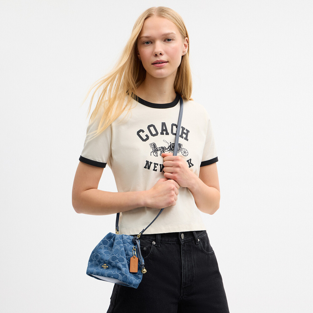Coach Outlet Faye Mini Drawstring Bag In Signature Denim